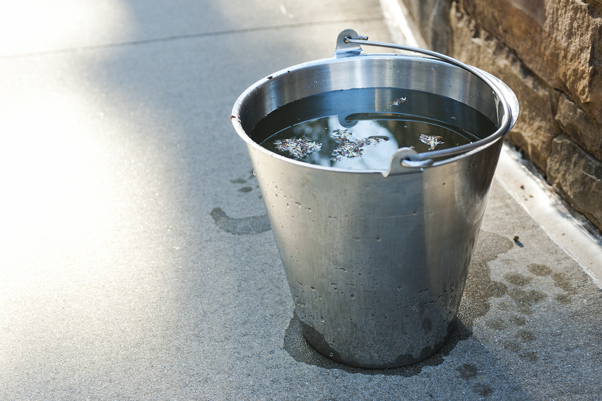 Bucket of water in an outdoor setting where mosquitoes with viruses could lay their eggs. Courtesy of the Public Health Image Library, Centers for Disease Control and Prevention.